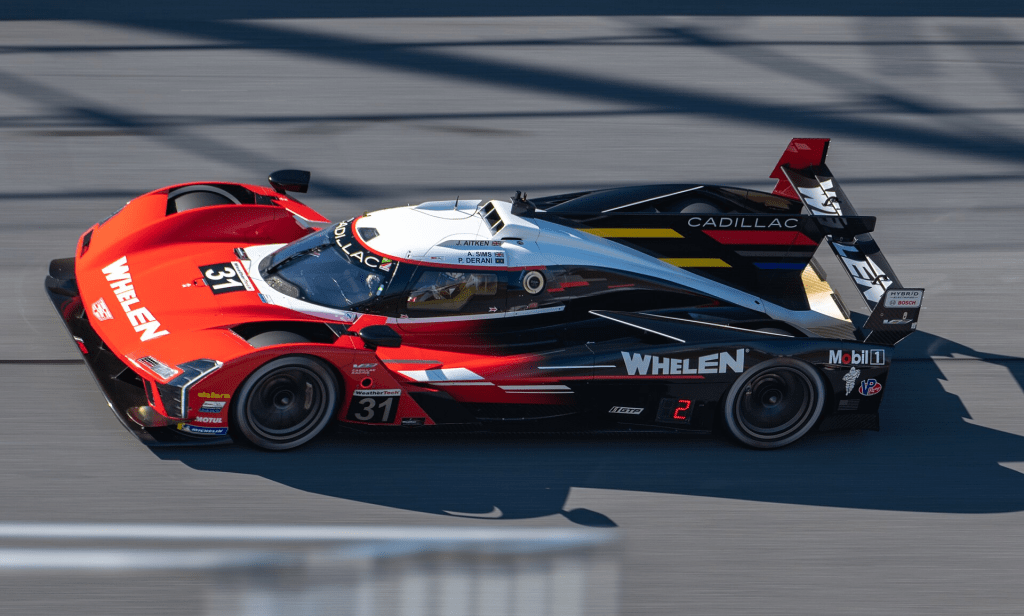 Cadillac V-Series.R in Action Express trim on the Daytona banking. Photo by Osajus Photography from Asheville, NC, United States - _DSC0924, licensed under CC BY 2.0, https://commons.wikimedia.org/w/index.php?curid=135628434
