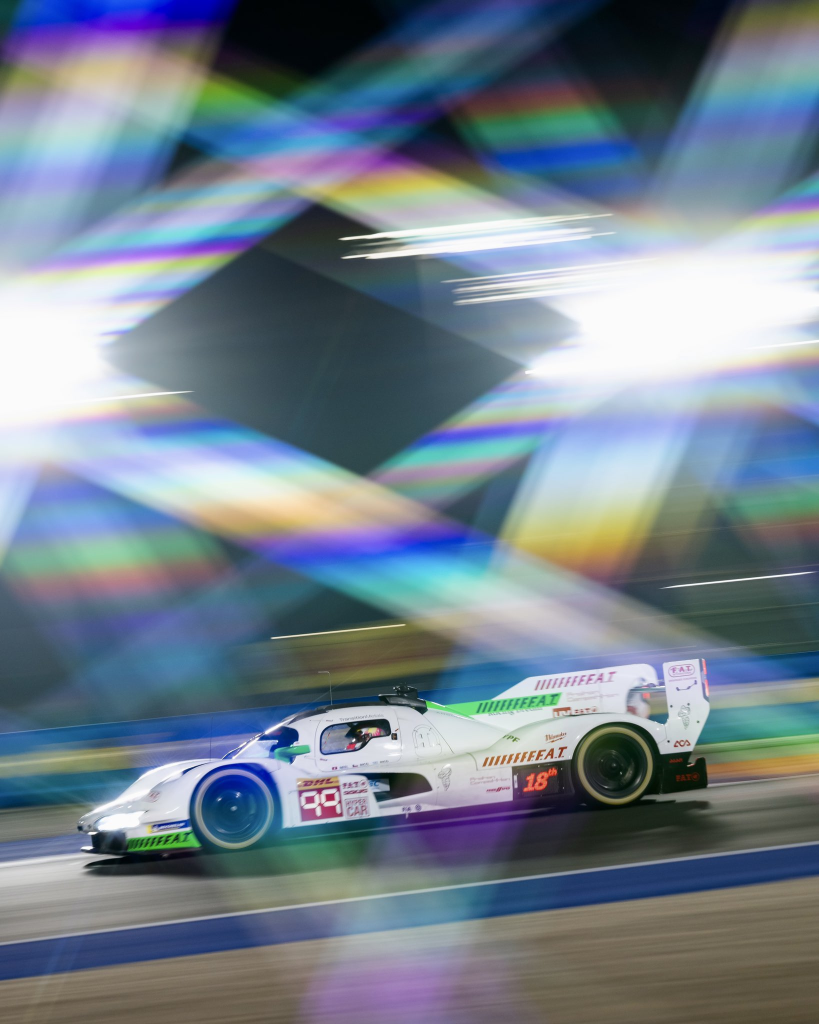 Ooh, lens flares. Somebody's done the kaleidoscope effect with this photo so we've got pretty rainbow diffraction bands above the #99 Porsche 963 hypercar (again at Qatar).